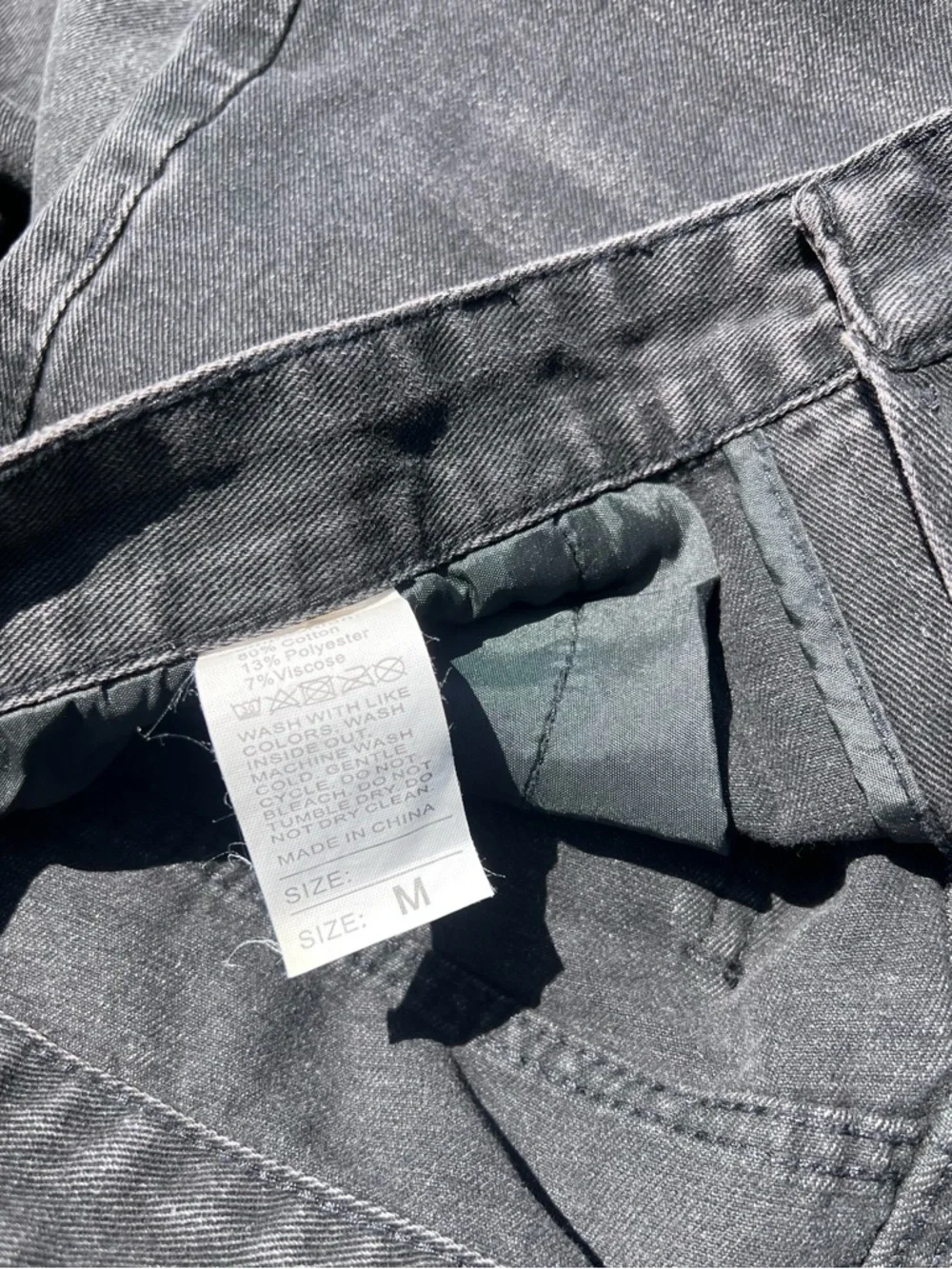 Relaxed Black Washed Jeans with Subtle White Paint Detail